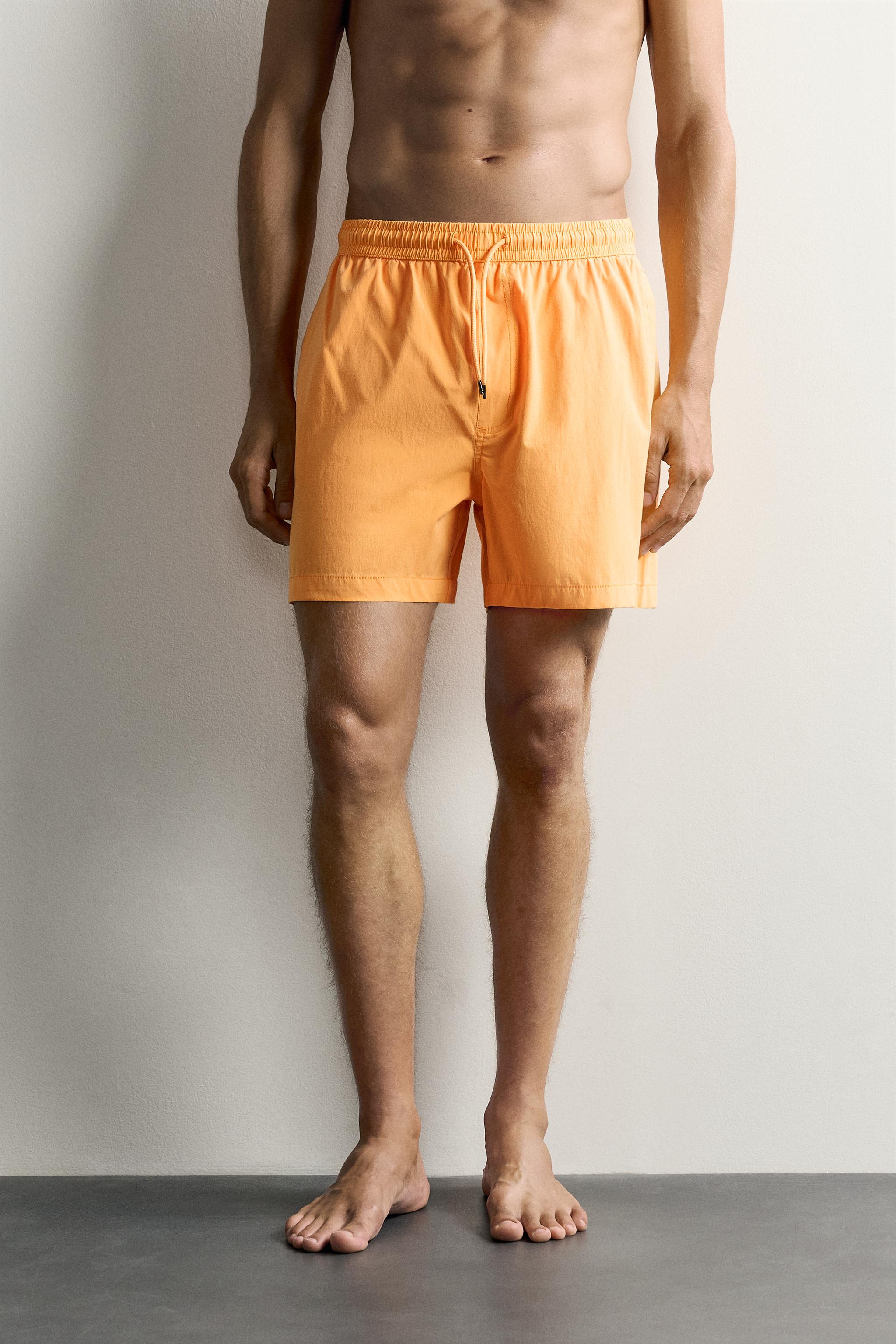 WASHED EFFECT LONG SWIM TRUNKS